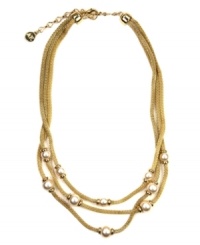 Go for the gold. AK Anne Klein's chic, three-strand necklace showcases mesh details and imitation plastic pearls. Crafted in a gold tone mixed metal setting. Approximate length: 17-1/2 inches + 3-inch extender. Approximate drop: 1 inch. Go for the gold. AK Anne Klein's chic, three-strand necklace showcases mesh details and imitation plastic pearls. Crafted in a gold tone mixed metal setting. Approximate length: 17-1/2 inches + 3-inch extender. Approximate drop: 1 inch.