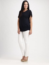A sleek jersey design with alluring lace-up and gilded details on short sleeves. The side ruching will flawlessly complement your curves.ScoopneckLace-up detail at short sleevesGilded cord endsRuched sidesPull-on styleAbout 28 from shoulder to hem95% rayon/5% spandexMachine washImported A sleek jersey design with alluring lace-up and gilded details on short sleeves. The side ruching will flawlessly complement your curves.ScoopneckLace-up detail at short sleevesGilded cord endsRuched sidesPull-on styleAbout 28 from shoulder to hem95% rayon/5% spandexMachine washImported