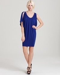 This flirty frock puts a modern twist on Grecian goddess with a touch of '70s flair. Disco-inspired flutter sleeves and a sultry scoop neckline make this the perfect party dress--on or off the dance floor. This flirty frock puts a modern twist on Grecian goddess with a touch of '70s flair. Disco-inspired flutter sleeves and a sultry scoop neckline make this the perfect party dress--on or off the dance floor.