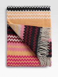 A special accent on the edge of a bed or sofa in a cozy and colorful, wool-blend chevron design. 51 X 75 Wool/polyester; machine wash Made in Italy A special accent on the edge of a bed or sofa in a cozy and colorful, wool-blend chevron design. 51 X 75 Wool/polyester; machine wash Made in Italy