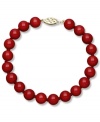 Crimson chic. This stunning strand bracelet features bold red agate (80 ct. t.w.) in a polished 14k gold setting. Approximate drop: 7-1/2 inches. Approximate bead diameter: 8 mm.