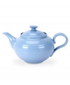 Like a blooming bed of forget-me-nots, this powder-blue porcelain dinnerware has a fresh, natural vibrance. A hand thrown texture gives the round, contemporary teapot the irresistible charm of traditional pottery.