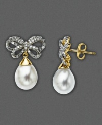 A treat for a special occasion or an everyday delight. These 14k gold cultured freshwater pearl (8-10 mm) earrings suspend from bows adorned with shimmering round-cut diamonds (1/3 ct. t.w.). Approximate drop: 3/4 inch. A treat for a special occasion or an everyday delight. These 14k gold cultured freshwater pearl (8-10 mm) earrings suspend from bows adorned with shimmering round-cut diamonds (1/3 ct. t.w.). Approximate drop: 3/4 inch.
