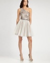 So flirty and festive: a full, playful tulle skirt is crowned by a sequined bodice decorated with a subtle floral pattern.Asymmetrical necklineSleevelessSequined bodiceFull tulle skirtConcealed side zipFully linedAbout 20 from natural waistPolyesterDry cleanImportedModel shown is 5'11 (180) wearing US size 4. 