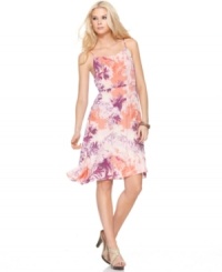 A tropical floral print gets a little abstract and rendered in a modern color palette in this Calvin Klein Jeans dress. A tropical floral print gets a little abstract and rendered in a modern color palette in this Calvin Klein Jeans dress.