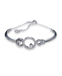 Gorgeously geometric. Featuring a circular motif, Swarovski's Maskerade bangle bracelet is embellished with sparkling bezel-set and clear pavé crystals. Crafted in silver tone mixed metal. Approximate diameter: 2-1/4 inches + 1-1/2 inch extender. Gorgeously geometric. Featuring a circular motif, Swarovski's Maskerade bangle bracelet is embellished with sparkling bezel-set and clear pavé crystals. Crafted in silver tone mixed metal. Approximate diameter: 2-1/4 inches + 1-1/2 inch extender.