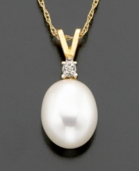 Supreme sophistication. A freshwater pearl (8-10 mm) with diamond accents beams on 14k gold V-shaped bale. Chain measures 16 inches; drop measures 5/8 inch. Supreme sophistication. A freshwater pearl (8-10 mm) with diamond accents beams on 14k gold V-shaped bale. Chain measures 16 inches; drop measures 5/8 inch.