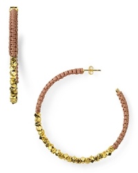 Cool and crafty. A simple shape gets a shot of color with these hoop earrings from Shashi, wrapped in bright nude cord.