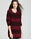 Crisp rugby stripes embolden a slouchy Burberry Brit sweater for sporty-chic style.