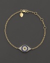 The traditional evil eye charm is lavishly updated with sparkling diamonds and blue, white and yellow sapphires.