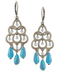 Update your look with intricate design and a touch of color. Carolee's elegant chandelier earrings feature a cut-out teardrop design with reconstituted turquoise drops and faceted glass beads. Set in burnished gold tone mixed metal. Approximate drop: 2-3/4 inches. Update your look with intricate design and a touch of color. Carolee's elegant chandelier earrings feature a cut-out teardrop design with reconstituted turquoise drops and faceted glass beads. Set in burnished gold tone mixed metal. Approximate drop: 2-3/4 inches.