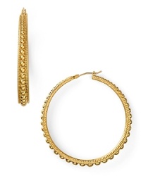 Tap this season's textured trend with this pair of hoop earrings from Carolee, featuring graduated beads for eye-catching shine. Tap this season's textured trend with this pair of hoop earrings from Carolee, featuring graduated beads for eye-catching shine.