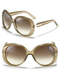 Style yourself like a sixties siren in these oversize shades from Gucci. Rounded grey frames are a chic yet unexpected choice. Style yourself like a sixties siren in these oversize shades from Gucci. Rounded grey frames are a chic yet unexpected choice.