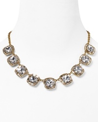 Paint the town gold with this kate spade new york statement necklace, accented by a bib of bold crystal stone stations. It's a luxe layering piece. Paint the town gold with this kate spade new york statement necklace, accented by a bib of bold crystal stone stations. It's a luxe layering piece.