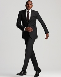 Luxe suit made from a fine Italian wool. Notched lapel jacket with three button closure and front flap pockets. Interior pocket, back vent. Pants are flat front with zip fly and hook closure. Trouser pockets at sides and welt pockets in back. Luxe suit made from a fine Italian wool. Notched lapel jacket with three button closure and front flap pockets. Interior pocket, back vent. Pants are flat front with zip fly and hook closure. Trouser pockets at sides and welt pockets in back.