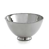 Marked by incredible handcrafting, this serving bowl features a rim embellished with countless molten beads carefully placed by a highly skilled artisan. The look is streamlined, timeless, organic and soulful. Marked by incredible handcrafting, this serving bowl features a rim embellished with countless molten beads carefully placed by a highly skilled artisan. The look is streamlined, timeless, organic and soulful.