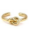 The on-target Archer cuff melds trend-smart knotted loops with glossy goldtone daring. Perfect peeking from the cuff of a fitted jacket over flared pants.