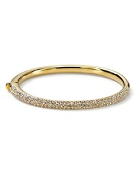The slender bangle from Nadri is crafted in polished rhodium plate with a triple-row of gleaming crystal pave to a bring a touch of light.