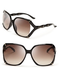 Be a style icon in these eternally chic Gucci sunglasses, with oversized, dark frames and luxe gold accents. Be a style icon in these eternally chic Gucci sunglasses, with oversized, dark frames and luxe gold accents.