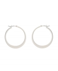Shimmery hoops with a modern spin. Kenneth Cole New York earrings feature a graduated hoop in silver tone mixed metal. Approximate diameter: 1-1/4 inches. Shimmery hoops with a modern spin. Kenneth Cole New York earrings feature a graduated hoop in silver tone mixed metal. Approximate diameter: 1-1/4 inches.