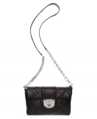 Diamond-quilted in super-soft lamb leather, this convertible purse by Calvin Klein turns heads (and turns into a clutch). Diamond-quilted in super-soft lamb leather, this convertible purse by Calvin Klein turns heads (and turns into a clutch).