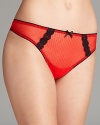 Accented with contrasting lace, this sheer mesh thong from Cosabella ensures a boost of confidence. Style #COQUE0321.