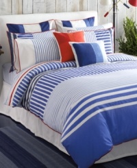 Bring the serene appeal of the sea to your bedroom with this nautical-inspired Mariner's Cove duvet cover set from Tommy Hilfiger, featuring blue stripes in different tones and alternating directions. Red trim completes this set for a look of coastal charm. Bring the serene appeal of the sea to your bedroom with this nautical-inspired Mariner's Cove duvet cover set from Tommy Hilfiger, featuring blue stripes in different tones and alternating directions. Red trim completes this set for a look of coastal charm.