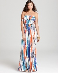 An abstract print lends artistic flair to this GUESS strapless maxi dress, flaunting a feminine ruffle at the top. An abstract print lends artistic flair to this GUESS strapless maxi dress, flaunting a feminine ruffle at the top.