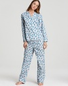 Go for a stylish bedtime look in this peacock feather printed pajama set from 40 Winks.