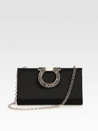 An elegant and versatile design in smooth satin embellished with an oversized, rhinestone accented logo closure.Detachable chain shoulder strap, 9½ dropHinged, fold-over top closureOne inside open pocketQuilted satin lining8W X 4½H X 1½DMade in Italy An elegant and versatile design in smooth satin embellished with an oversized, rhinestone accented logo closure.Detachable chain shoulder strap, 9½ dropHinged, fold-over top closureOne inside open pocketQuilted satin lining8W X 4½H X 1½DMade in Italy