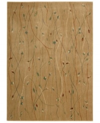 With a flowing floral motif, this area rug offers an organic appeal to your decor. Vines intertwine over an earthy gold background, each branch hand-carved to add that extra dimension and eye-pleasing interest. With a flowing floral motif, this area rug offers an organic appeal to your decor. Vines intertwine over an earthy gold background, each branch hand-carved to add that extra dimension and eye-pleasing interest.