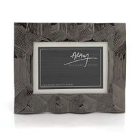 With nods to the beauty of tortoise shell, this convertible frame is a captivating way to display your favorite photos. With nods to the beauty of tortoise shell, this convertible frame is a captivating way to display your favorite photos.