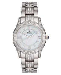 A stunning watch from Bulova with timeless glamor and style. Silvertone stainless steel bracelet with crystal accents and round case. Crystal accents at bezel. Round mother-of-pearl dial with logo and Roman numerals at indices. Quartz movement. Water resistant to 30 meters. Three-year limited warranty. A stunning watch from Bulova with timeless glamor and style. Silvertone stainless steel bracelet with crystal accents and round case. Crystal accents at bezel. Round mother-of-pearl dial with logo and Roman numerals at indices. Quartz movement. Water resistant to 30 meters. Three-year limited warranty.