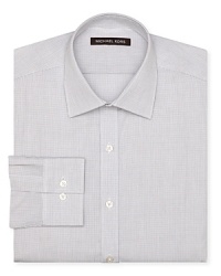 The tiny windowpane check design of this dress shirt exudes classic sophistication with modern flair, tailored for a regular fit from the always dapper Michael Kors. The tiny windowpane check design of this dress shirt exudes classic sophistication with modern flair, tailored for a regular fit from the always dapper Michael Kors.