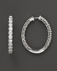 This gorgeous oval diamond hoop makes a charming accent to your daytime look and an elegant centerpiece to your evening ensemble. This gorgeous oval diamond hoop makes a charming accent to your daytime look and an elegant centerpiece to your evening ensemble.