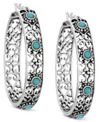A pattern that's pleasing to the eye. Filigree adds intricate elegance to these sterling silver hoop earrings Genevieve & Grace. Synthetic turquoise accents enhance the appeal. Approximate drop: 1-7/8 inches. Approximate width: 1-3/8 inches. A pattern that's pleasing to the eye. Filigree adds intricate elegance to these sterling silver hoop earrings Genevieve & Grace. Synthetic turquoise accents enhance the appeal. Approximate drop: 1-7/8 inches. Approximate width: 1-3/8 inches.