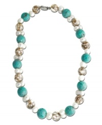 A careful arrangement of turquoise (15 mm), Mother of Pearl (14 mm) and cultured freshwater pearls (8 mm) transcend the ordinary to create a necklace of sheer depth and beauty. Set in sterling silver. Approximate length: 18 inches. A careful arrangement of turquoise (15 mm), Mother of Pearl (14 mm) and cultured freshwater pearls (8 mm) transcend the ordinary to create a necklace of sheer depth and beauty. Set in sterling silver. Approximate length: 18 inches.