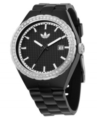 A sport watch with sparkle. The adidas Cambridge watch features a black rubber strap and round polycarbonate case. Crystal accents at bezel. Black textured dial with silvertone stick indices, logo and date window. Analog movement. Water resistant to 50 meters. Two-year limited warranty. A sport watch with sparkle. The adidas Cambridge watch features a black rubber strap and round polycarbonate case. Crystal accents at bezel. Black textured dial with silvertone stick indices, logo and date window. Analog movement. Water resistant to 50 meters. Two-year limited warranty.