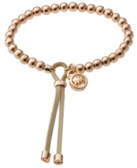 Aren't you chic? Stay in the loop with updated styles by Michael Kors. This beaded bracelet features polished beads and an adjustable leather closure. Beads and logo charm crafted from rose gold tone mixed metal. Bracelet stretches to fit wrist. Approximate diameter: 2-1/2 inches. Aren't you chic? Stay in the loop with updated styles by Michael Kors. This beaded bracelet features polished beads and an adjustable leather closure. Beads and logo charm crafted from rose gold tone mixed metal. Bracelet stretches to fit wrist. Approximate diameter: 2-1/2 inches.