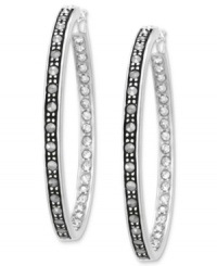 Inner, and outer, beauty. Genevieve & Grace's hoop earrings, set in sterling silver, dazzle with marcasite and crystal on the interior and exterior for a stunning look. Approximate diameter: 1-1/2 inches. Inner, and outer, beauty. Genevieve & Grace's hoop earrings, set in sterling silver, dazzle with marcasite and crystal on the interior and exterior for a stunning look. Approximate diameter: 1-1/2 inches.