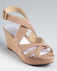 A wardrobe essential, these Delman sandals showcase a strappy silhouette in soft, nubuck leather and classic hues. A wardrobe essential, these Delman sandals showcase a strappy silhouette in soft, nubuck leather and classic hues.