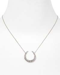 Dazzling Swarovski crystals shine on this horseshoe pendant necklace from Alexis Bittar.