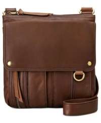 Hit the road with this travel-ready bag from Fossil and get to where you're in style. Spacious, pocket-lined and crafted from the softest leather, it's exquisitely outfitted for any excursion. Hit the road with this travel-ready bag from Fossil and get to where you're in style. Spacious, pocket-lined and crafted from the softest leather, it's exquisitely outfitted for any excursion.