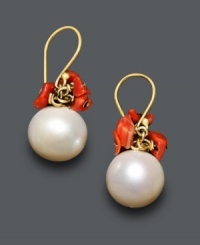 Sophistication and vibrant color all mixed into one. These artfully-crafted earrings feature a polished cultured freshwater pearl (9 mm) accented by bright coral ships. Crafted in 14k gold. Approximate drop: 1/2 inch. Sophistication and vibrant color all mixed into one. These artfully-crafted earrings feature a polished cultured freshwater pearl (9 mm) accented by bright coral ships. Crafted in 14k gold. Approximate drop: 1/2 inch.