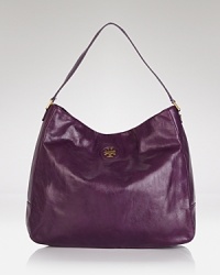 In leather, this Tory Burch holdall is a must for the round-the-clock wardrobe with a distinctive, urbane look that never quits. In leather, this Tory Burch holdall is a must for the round-the-clock wardrobe with a distinctive, urbane look that never quits.