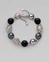 From the Elements Collection. Perfect mix of textures, this beaded design pairs black onyx, hematite and sterling silver.Hematite Black onyx Sterling silver Length, about 7½ Adjustable oval bead clasp Imported 