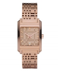 This Burberry watch features a check-inspired rose gold ion-plated stainless steel bracelet and rectangular case. Rose gold tone dial with check pattern features applied stick indices, minute track, date window at six o'clock, three hands and logo. Swiss made. Quartz movement. Water resistant to 50 meters. Two-year limited warranty. This Burberry watch features a check-inspired rose gold ion-plated stainless steel bracelet and rectangular case. Rose gold tone dial with check pattern features applied stick indices, minute track, date window at six o'clock, three hands and logo. Swiss made. Quartz movement. Water resistant to 50 meters. Two-year limited warranty.