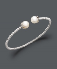 Add class to any look with polished pearls and a touch of shimmer. This sterling silver bangle bracelet features a unique beaded design that highlights two cultured freshwater pearls (8-1/2-9 mm) at the ends. Approximate diameter: 2-1/2 inches. Add class to any look with polished pearls and a touch of shimmer. This sterling silver bangle bracelet features a unique beaded design that highlights two cultured freshwater pearls (8-1/2-9 mm) at the ends. Approximate diameter: 2-1/2 inches.