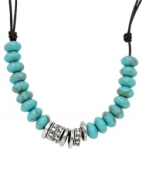 Rich turquoise and silver tones. Fossil's silver tone mixed metal necklace features beads made of both reconstituted turquoise and clear crystal pave. A chocolate leather cord holds everything together with a lobster claw closure. Approximate length: 16 inches + 2 inch extender. Rich turquoise and silver tones. Fossil's silver tone mixed metal necklace features beads made of both reconstituted turquoise and clear crystal pave. A chocolate leather cord holds everything together with a lobster claw closure. Approximate length: 16 inches + 2 inch extender.