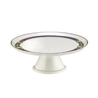A whimsical bridle decal accents this porcelain Ralph Lauren cake plate, finished with a luxe gold stripe at the base and rim. A whimsical bridle decal accents this porcelain Ralph Lauren cake plate, finished with a luxe gold stripe at the base and rim.